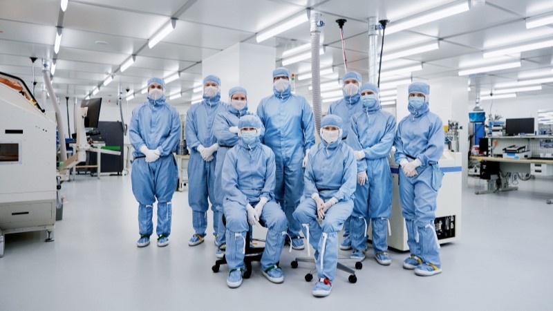 Employees in protective gear in cleanroom