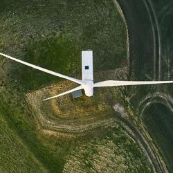 Wind turbine on a field - aerial view