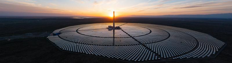 Panoramic view of solar thermal power station at sunset Panoramic view of solar thermal power station at sunset_HERO-tall